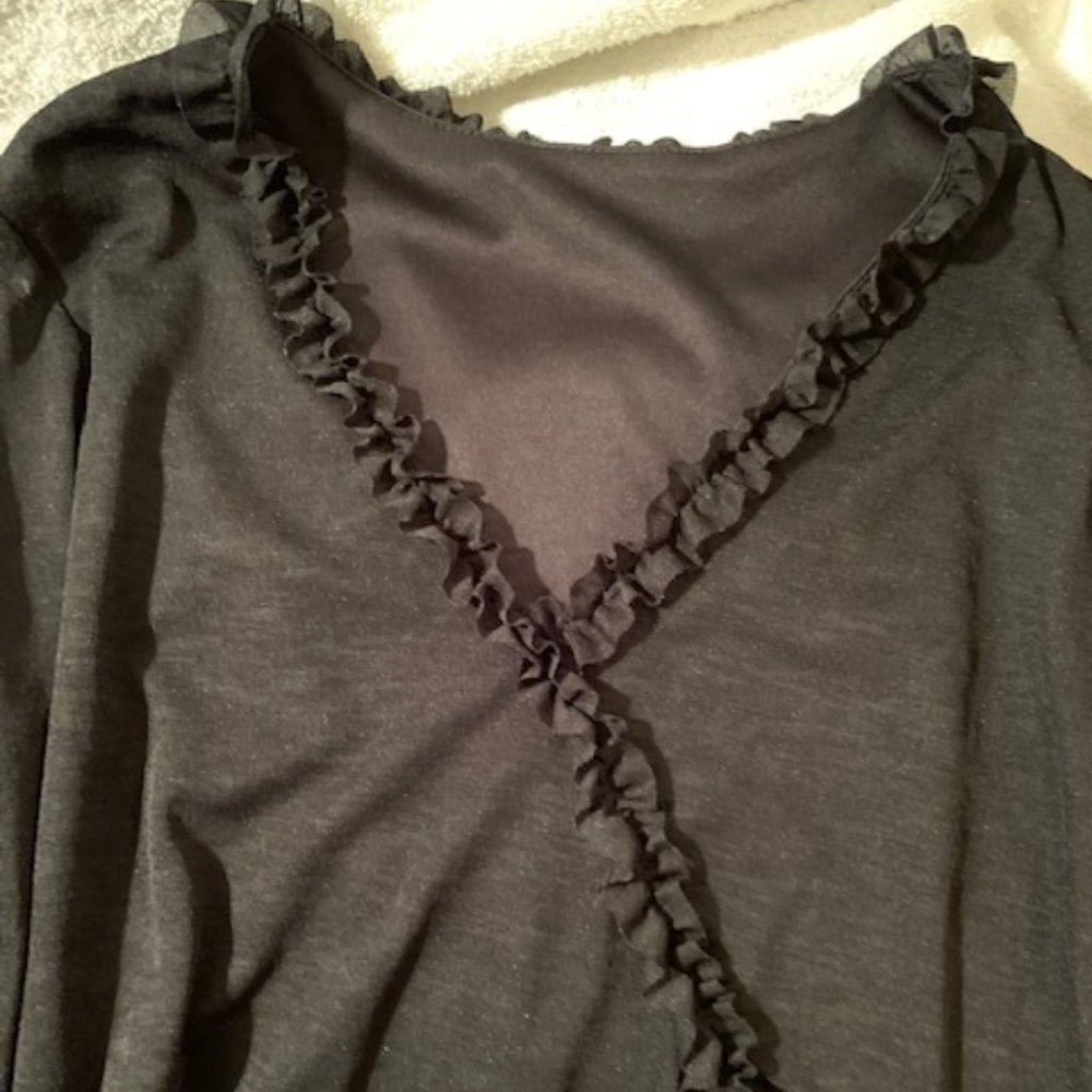 V-neck black ruffled blouse
